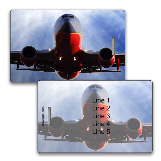 Head-on view of a Southwest 737 jet ascending against blue sky on custom luggage tag; back shows five editable info lines.